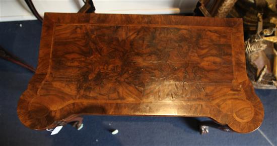 A fine George I figured walnut card table, W.2ft 10in. D.1ft 5in. H.2ft 5in.